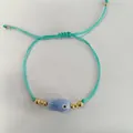 Bracelet cordon tissé ajustable vert menthe style océan avec charme poisson bleu - Style Poisson Mauvais Œil Bleu Clair (B-B25081102I)
