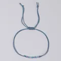 Bracciale in cordino blu intrecciato con perline colorate e nodo scorsoio regolabile. - Stile Celeste (GZ-B23122602G)
