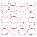 Set of adjustable red string braided bracelets with evil eye and heart charms for daily wear - 12-Piece Style 1 (JS-S25110101A)