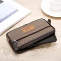 Close-up of the durable men's canvas phone pouch with three zippers showing smartphone fit. - Single Layer / 17.5cm / Coffee