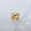 Macro view of a gold-plated teardrop zircon ring with multi-layer spiral band. - Size 6 / Large Water Drop Open Style / Gold