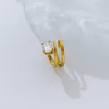 Close-up of a multi-layer 18K gold plated ring with a clear oval zircon stone. - Size 6 / Spiral Large Oval Style / Gold