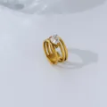 Macro view of a teardrop-shaped zircon set on a stylish multi-layer 18K gold plated ring - Size 6 / Layered Water Drop Style / Gold