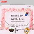 Detail view of pink balloon arch frame with water base and assembly accessories. - Arch Kit Medium