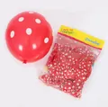 Detail of red polka dot latex balloons showing inflated sample and retail packaging - Dot Pattern Style / 1 Pack / Red