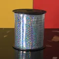 Detailed macro view of a 250-yard roll of holographic silver laser ribbon for party decoration - 250 Yards/Pack / Silver