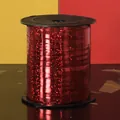 Detailed macro view of shiny red laser holographic ribbon roll for wedding party decor - 250 Yards/Pack / Red