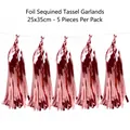 Detailed showcase of five hanging rose gold metallic foil tassels for festive party decor - 5 Pieces / Rose Gold