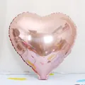 Close-up detail of a shiny 18-inch rose gold heart foil balloon for party decor - Heart / 18 Inch