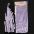 Detail of purple DIY tissue paper tassel garland set showing packaging and assembly - Purple