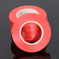Close-up detail view of multiple stacked bright red balloon ribbons for festive party decoration - 10 Meters / Red
