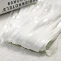 Close-up detail showing the texture of white metallic fringe tinsel curtain backdrops - 1*2M / Macaron White