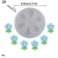 Detail view of a round flower silicone mold showing dimensions and sample outputs - Small Flower Style (2) / 6.9cmx0.8cm