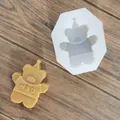 Detailed view of a bear-shaped silicone mold and a matching wax candle with HBD text. - Teddy Bear / White