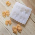 Detailed view of silicone bow mold with four different sized cavities and finished samples - 4-Cavity Large Square Bowknot