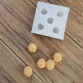 Detailed view of raspberry shaped silicone mold with finished wax samples - Raspberry