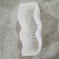 Detail view of wavy silicone mold with 'OH SHIT' letter engraving for DIY crafts - OH SHIT