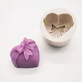 Close-up of heart-shaped silicone mold with bow detail for DIY soap and candles. - Bow Combination