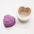 Detailed macro view of heart-shaped silicone mold with LOVE embossed soap creation - Love Heart