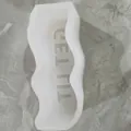 Close-up of a white wavy silicone mold featuring embossed GET LIT phrase for DIY - GET LIT