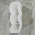 Macro detail of white wavy silicone candle mold with internal WEEKEND text relief - MELT ME