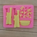 Detailed close-up of a pink silicone mold showing bamboo and leaf shapes for cake decorating - Bamboo Leaf