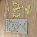 Detail view of European relief silicone mold with finished angel and scroll pieces - Style 1 (Angel Relief) / 1