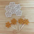 Detailed view of flower silicone mold with finished chocolate lollipops on wooden surface - 6-Cavity Irregular Flower / Translucent White