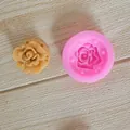 Macro detail view of pink rose silicone mold with a finished floral cake decoration piece - Rose / Large Flower with Pattern / Pink
