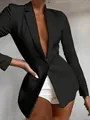 Close-up detail of black slim-fit blazer with deep V-neck and single button closure. - S / Tops / Black