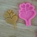Macro view of heart-shaped tree silicone mold and brown cast chocolate piece for Valentine - 4-Cavity Heart