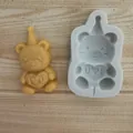 Detail view of bear silicone mold and finished chocolate bear with I Love You heart - Bear with Hat