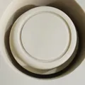 Top-down macro view of white tiered silicone mold base for music boxes and chocolates - Music Box Base