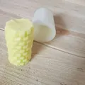 Detailed macro view of honeycomb texture on cylindrical silicone mold and candle - Honeycomb Style