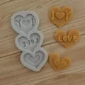 Detailed view of heart-shaped silicone mold with LOVE and I Love You text designs - Triple Heart