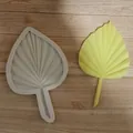 Close-up detail of a textured palm leaf silicone mold next to a finished yellow fondant leaf. - Single Leaf Large / White