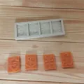 Detalle del molde de silicona con símbolos de moneda como dólar y euro para decorar pasteles - Molde de 4 Cavidades con Símbolos de Moneda