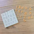 Detail view of number and symbol silicone mold for chocolate and cake decoration - Symbol (&)