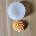High-quality detail view of a spiral swirl silicone mold with a finished fondant biscuit shape - 3# (Single Hole Spiral)