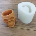 Detailed view of 3D skull silicone mold with a finished terracotta skull candle holder - Skull without Flowers / Translucent White