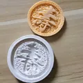 Detail of white silicone mold and soap piece with embossed Chinese longevity character. - Longevity Character