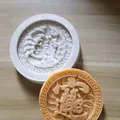 Macro detail of silicone baking molds featuring traditional Chinese dragon and prosperity motifs. - Wealth and Treasure