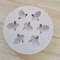 Detailed view of a 7-cavity bee-shaped silicone mold for fondant and chocolate decor - 7-Cavity
