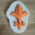 Detail of European relief silicone mold with orange acanthus leaf fondant decoration - Style 4 (Baroque Acanthus Leaf)
