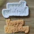 Close-up detail showing the white silicone mold and Happy Birthday fondant cake topper lettering. - Cartoon Large