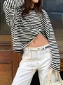 Detail view of a relaxed black and white striped long sleeve tee with a vintage vibe - S / Tops / Black