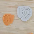 Macro detail of 'Hi' speech bubble silicone mold alongside an orange finished piece - HI Text Style