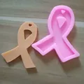 Close-up detail showing a pink ribbon silicone mold and a finished heart pendant mockup - Heart Ribbon Style / Pink