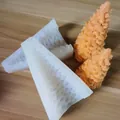 Close-up of 3D Christmas tree silicone mold with finished orange textured wax candles - Christmas Tree Large Mold