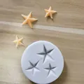 Close-up of a blue silicone baking mold for 3D star-shaped fondant or chocolate creations - 3 Stars / Light Blue